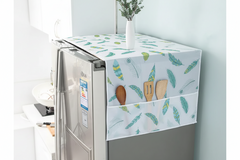 Fridge with a decorative cover featuring feather patterns and wooden utensils, with a red tag and text overlay.